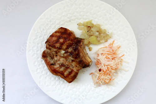 White plate with baked pork loin