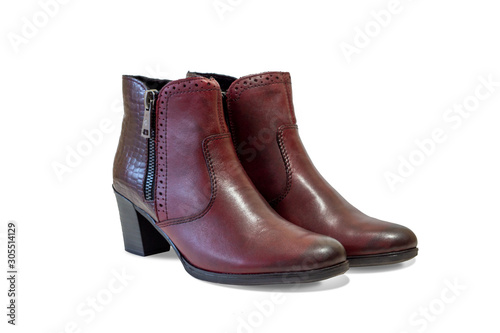 modern women's ankle boots rich red-brown color. side view. isolated on a white background.