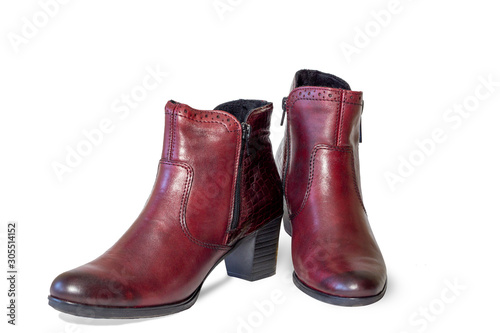 modern women's ankle boots rich red-brown color isolated on a white background.