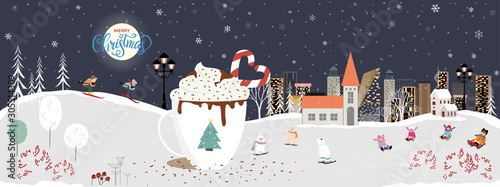 Winter night with Christmas and new year celebrated in the city,Cute winter wonderland in the town with with big mug of hot Chocolate and candy cane, kids sledding and couple with skiing in the hills
