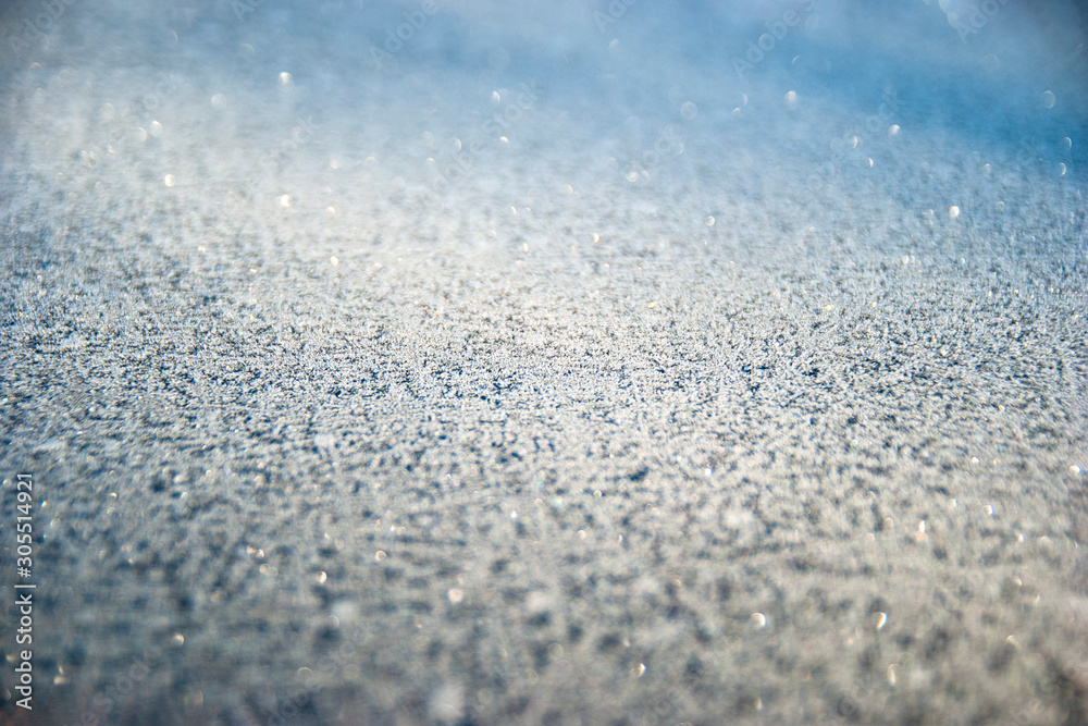 Obraz premium Winter drawing. Christmas background. Ice crystals on a glass.