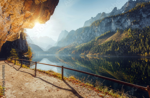 Wonderful Sunny Landscape at Vorderer Gosausee lake in Austrian Alps. Awesome alpine highlands at sunset. Fairy autumn scene in Alpine highland.  Picturesque view of nature. amazing natural Background photo