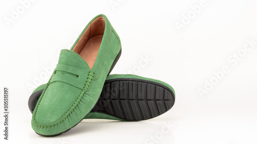 Green suede men moccasin isolated on white. photo