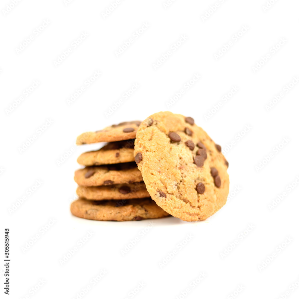 Some sweet cookies with chocolate laying on top of each other and one is near on isolated white background. Some sweet cookies with chocolate laying on top of each other and one is near on isolated white background.