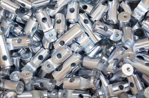 Steel sleeve. Details made lathe. Obtained on a lathe from steel and cast iron. Shallow depth of field. Parts stacked for further processing. Galvanized, coated part for anti-corrosion. Machined pipe