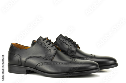 Pair Of Black leather Brogue Derby isolated on a white background.