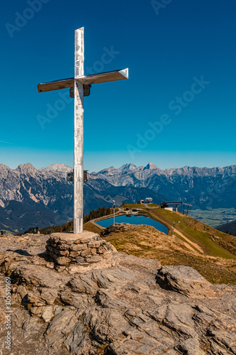 Beautiful alpine view with a summit cross at Leogang, Salzburg, Austria