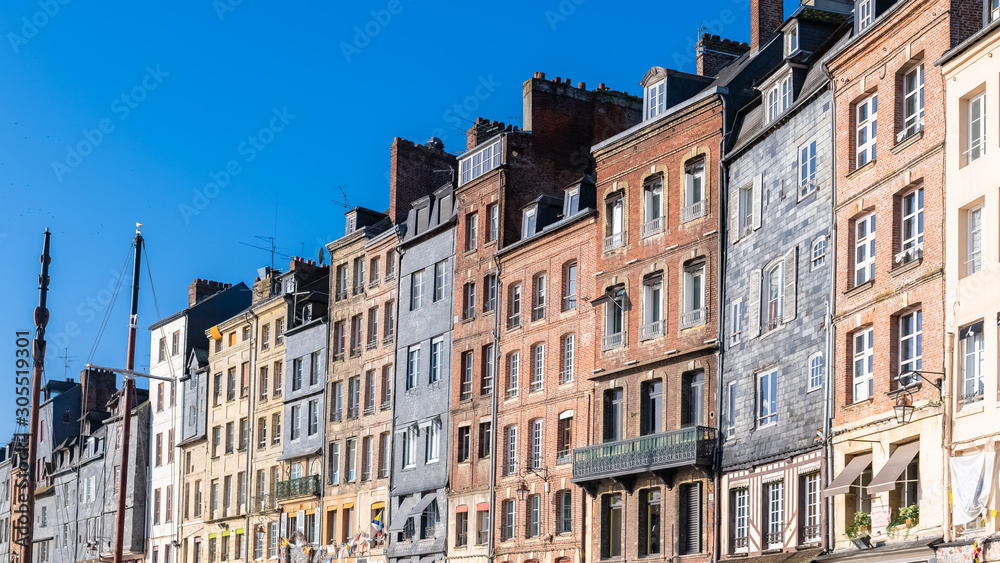 Fototapeta premium Honfleur, Normandy, typical houses with half-timbered facade in the harbor