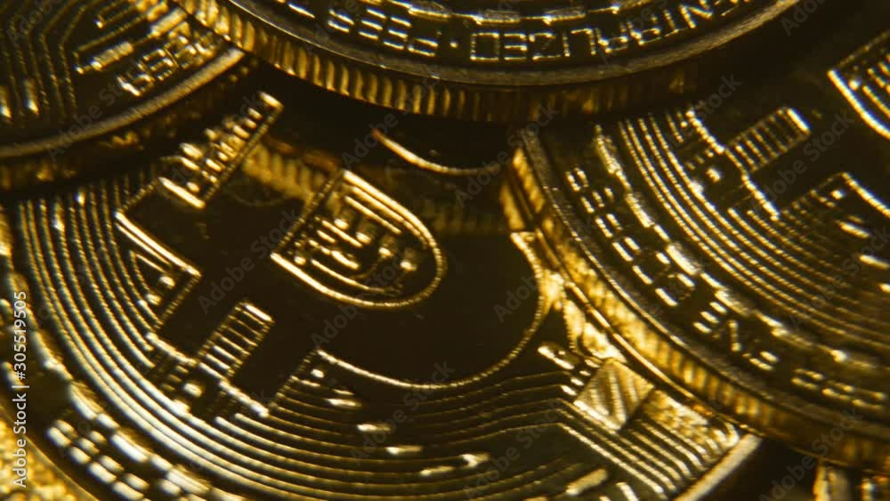 Bitcoin gold coin is spinning. Worldwide virtual cryptocurrency and digital payment system. Macro shooting