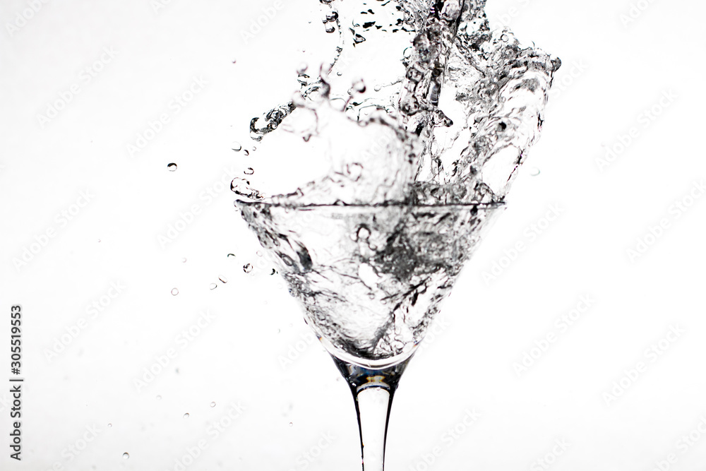 Black-white glass with champagne splashes on a white background Black-white glass with champagne splashes on a white background
