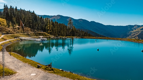 Beautiful alpine view with reflections in a lake at Leogang, Salzburg, Austria