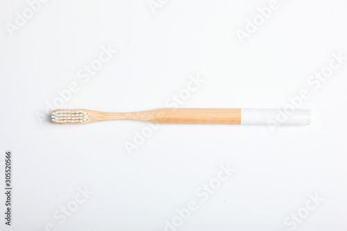 natural bamboo toothbrushes on a light background top view. Oral and dental care.