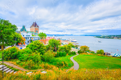 Quebec City Skyline with Chateau Frontenac and St Lawrence River against Blue Cloudy Sky in Summer