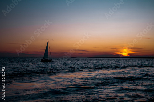 Landscape yachts in the sea at sunset © Yuliya Timofeeva
