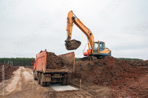 Wallpaper Mural Large construction excavator at construction work. Special machinery Torontodigital.ca