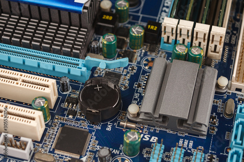 Photos BIOS battery chips close-up macro on the motherboard of the computer, the firmwa