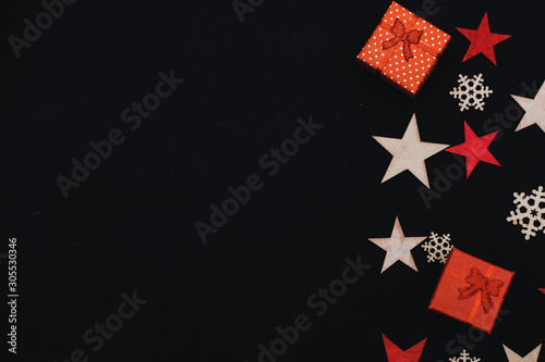 handmade wooden stars and snowflakes isolated on black background, beautiful christmas decoration