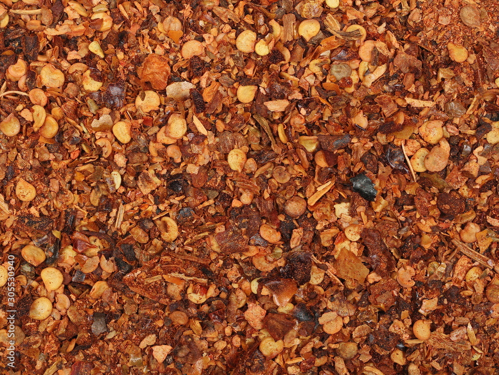 Crushed red pepper, dried chili flakes and seeds texture Crushed red pepper, dried chili flakes and seeds texture