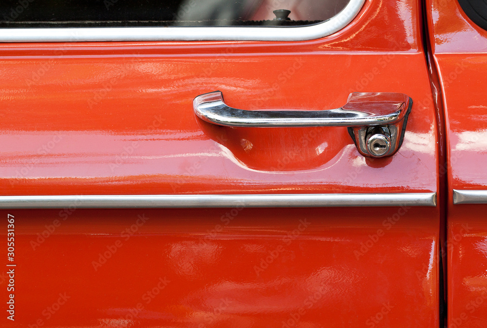red retro car door with a beautiful stylish handle