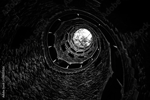 The famous Initiation Well at Quinta da Regaleira, Sintra, Portugal. Black and white image. photo