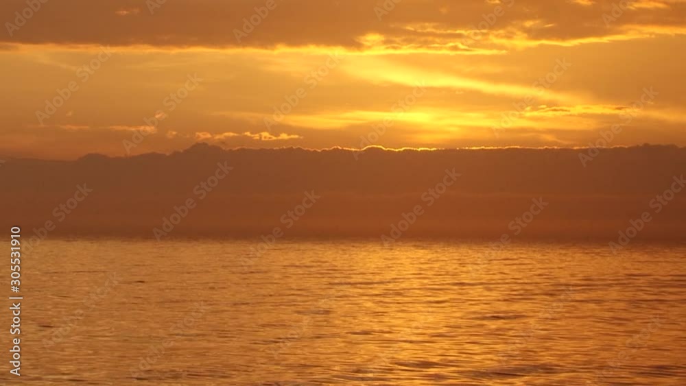 Summer orange sunset on the river, clouds in the sky. Summer orange sunset on the river, clouds in the sky.