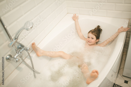 Kid bathe in the bathroom