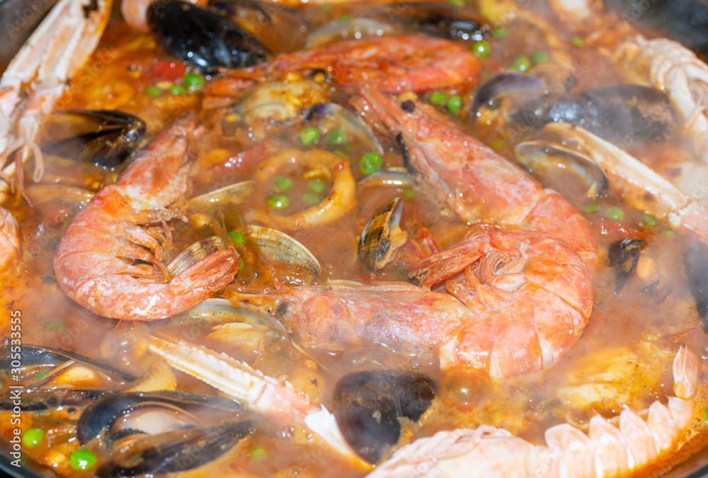 Details of a typical Spanish paella of arrzoz with prawns, squid, sepia, mussels and monkfish. Details of a typical Spanish paella of arrzoz with prawns, squid, sepia, mussels and monkfish.