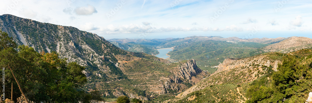 Panoramic unique view of Lasithi mountains heights and Aposelemi river lake. Wilderness mountaineering trekking paradise, high altitude hiking paths, trails and peaks. Heraklion, Crete Greece