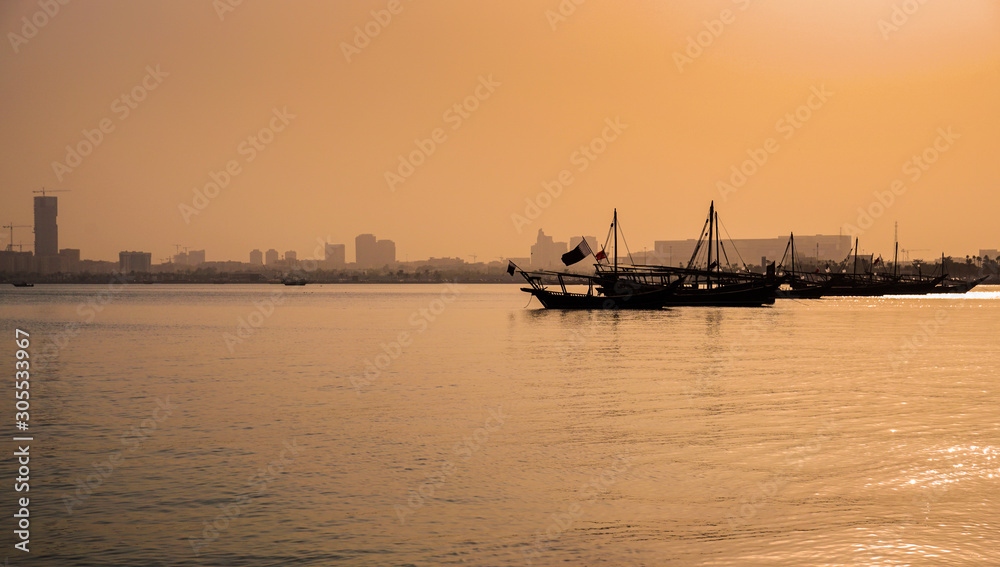 Obraz premium Doha Bay With Traditional Wooden Dhow Fishing Boats. View from Corniche, Doha, Qatar