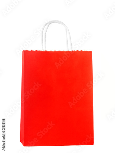 Paper red shopping or gift bag isolated on white background. The concept of shopping or gifts.