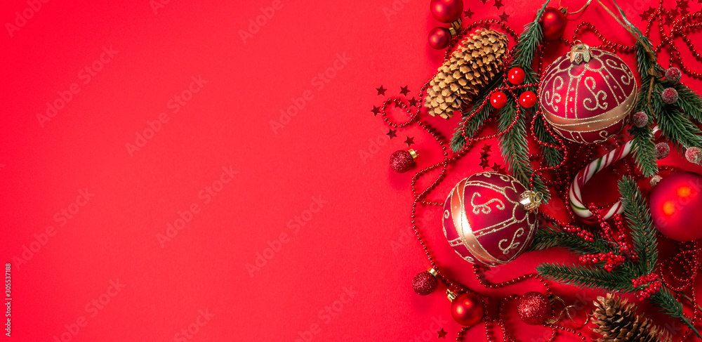 Christmas decorations on red background, top view