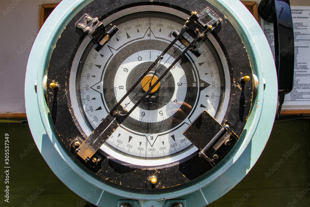 Naklejka premium A big old compass of a trading ship.