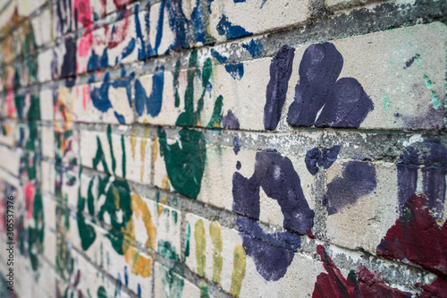 Wall with handprints on a playground.