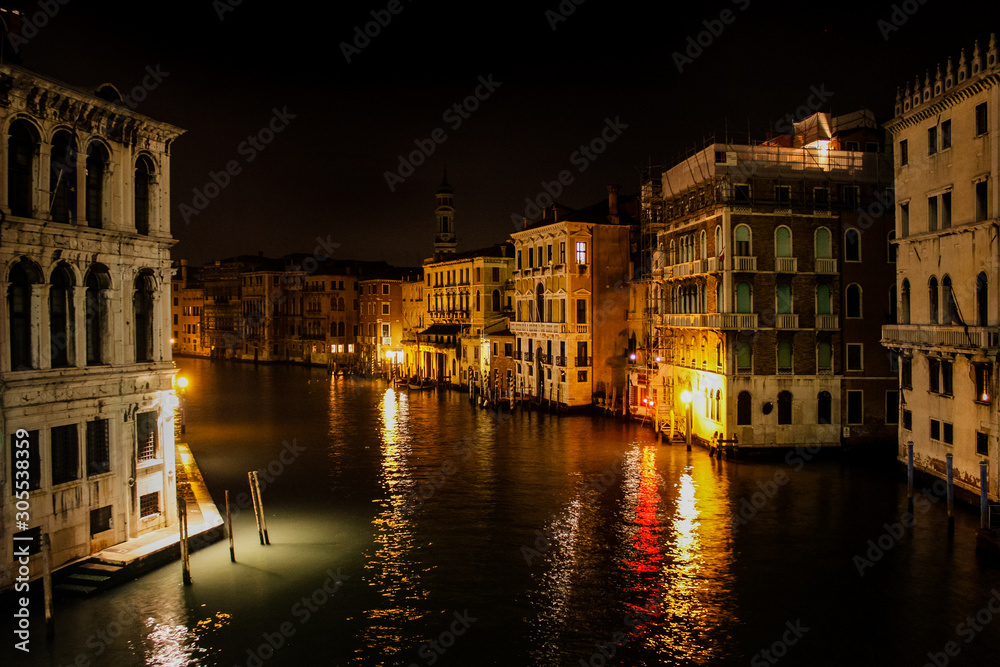 grand canal night scene in Venice with no one and many lights and reflections, Italy