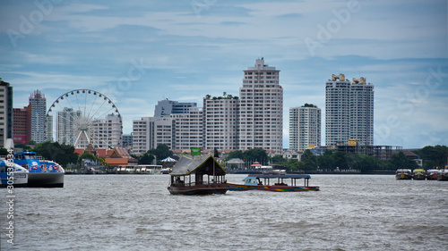 Photography Cityscape view of Bangkok with boats on the Chao Phraya River and with the Asiat