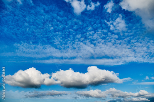 Summer day and blue sky with volumetric clouds. White clouds and blue sky. © Dmitrii_Gr