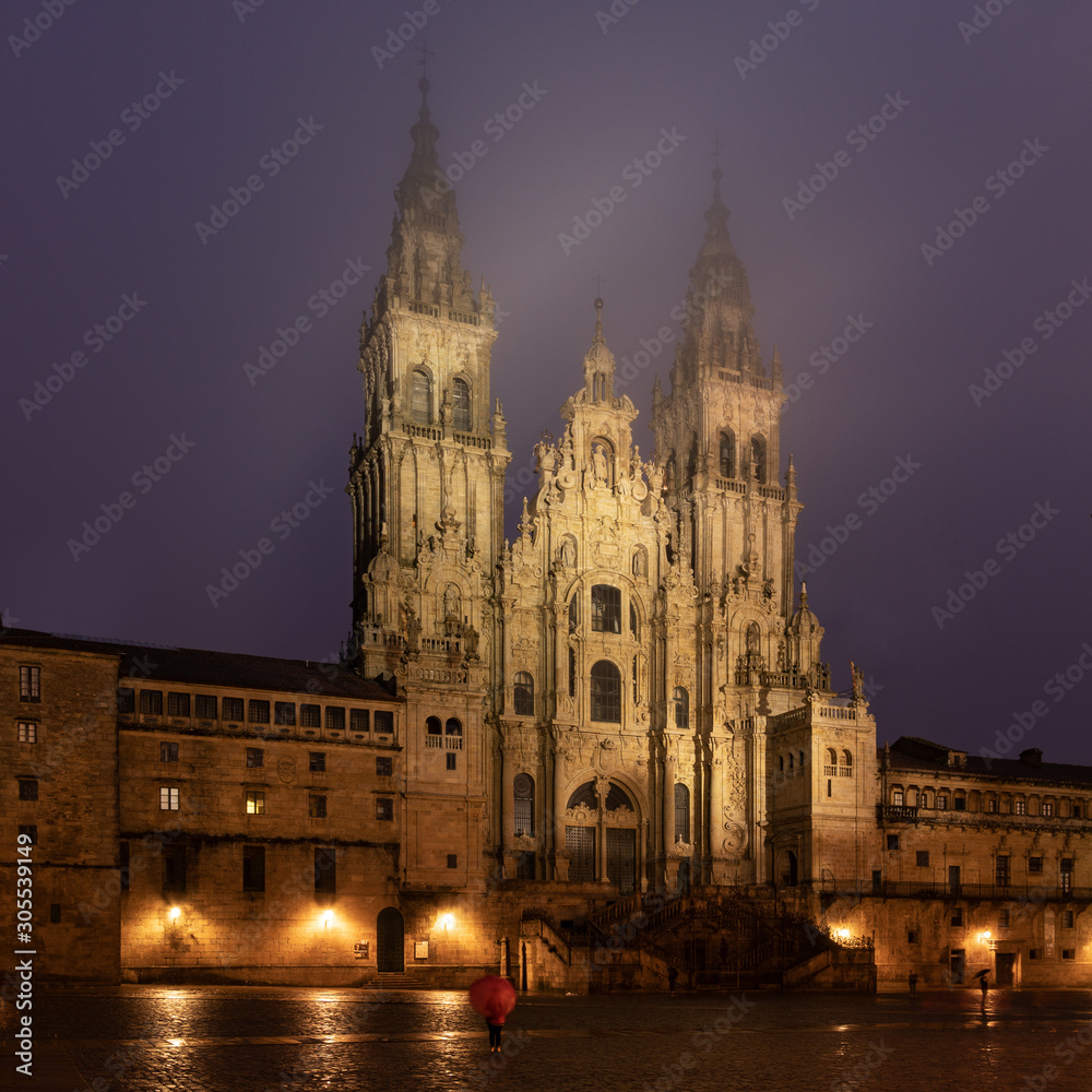 Santiago de Compostela Cathedral view at misty foggy night after rain. Cathedral of Saint James pilgrimage. Galicia, Spain