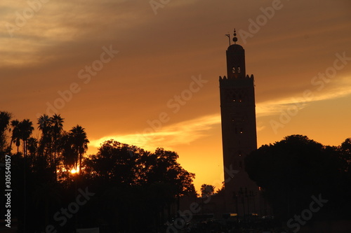 Panoramic view of the Sunset in the tower of the Marrakech square from a terrace. Morocco