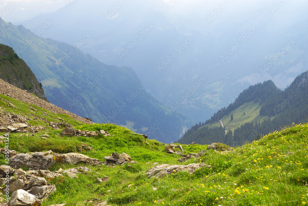 Naklejka premium Alpine peaks landskape background. Jungfrau, Bernese highland. Alps, tourism, journey, hiking concept.