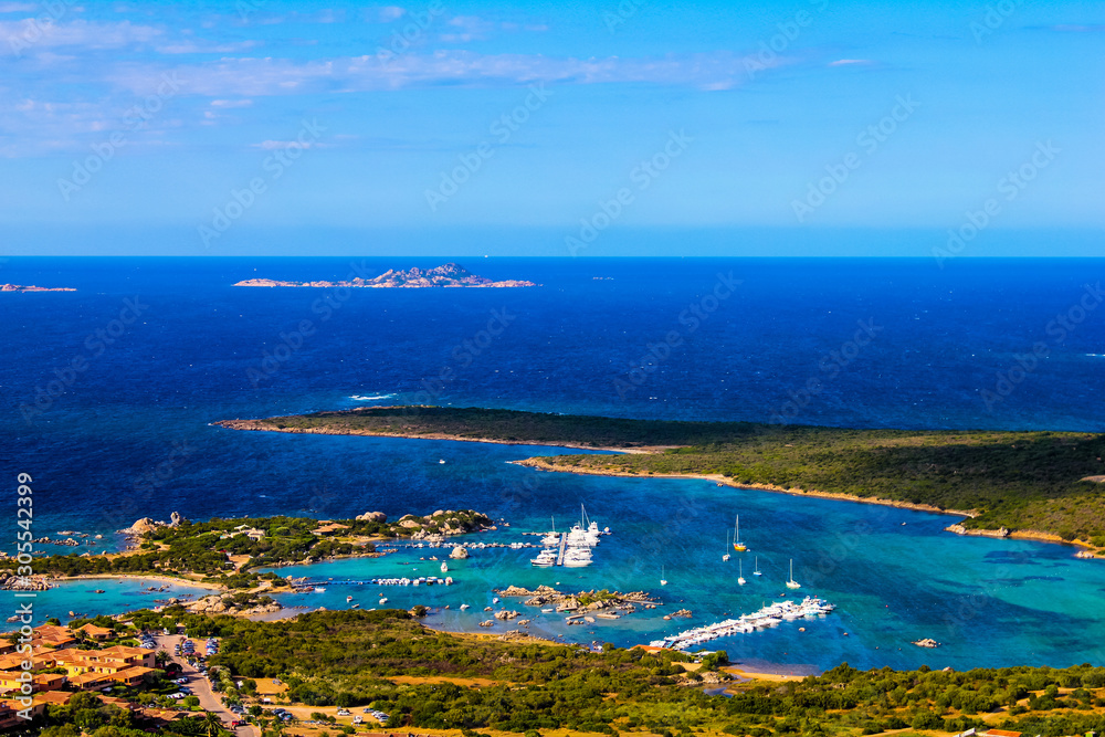 panoramic view of the gulf of marinella during a sunny summer day with the island of mortorio in the distance, Sardinia, Italy