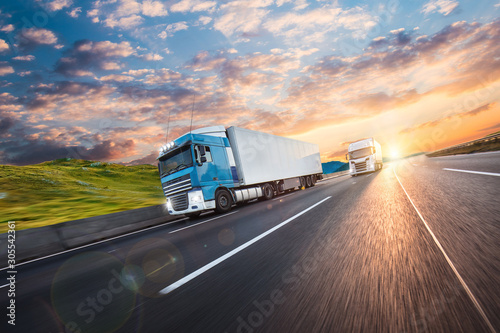 Truck with container on road, cargo transportation concept.