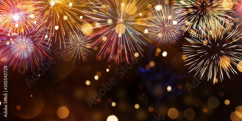 Fototapeta Colorful firework with bokeh background. New Year celebration.