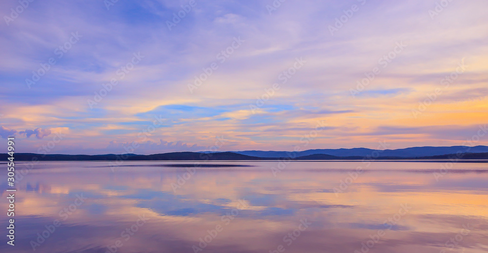 Beautiful clouds reflected on the surface of the lake Beautiful clouds reflected on the surface of the lake