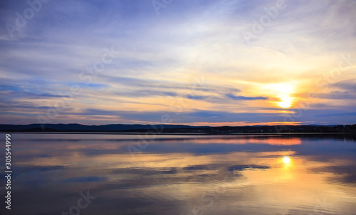 Beautiful clouds reflected on the surface of the lake © Yuri Bizgaimer