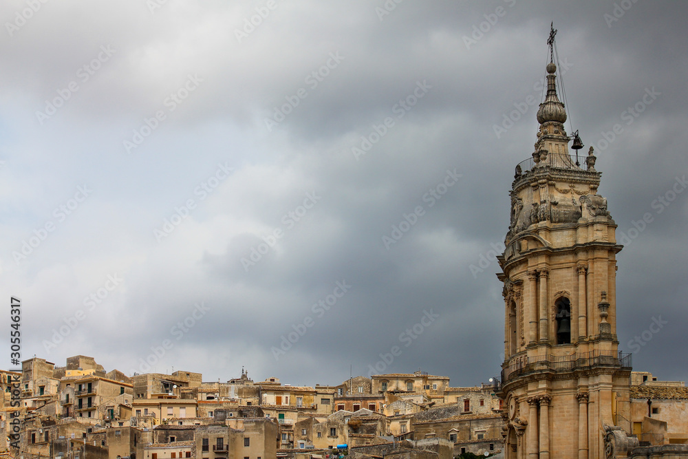 Front view of the Cathedral of San Giorgio on a cloudy summer day in Modica, Sicily, Italy