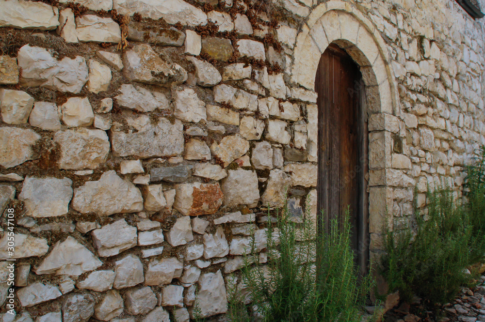 Stone paved medieval street of the famous city of Berat, Albania