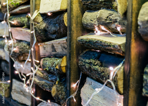 Wallpaper Mural Wooden chocks laid horizontally between the boards and decorated with a luminous garland Torontodigital.ca