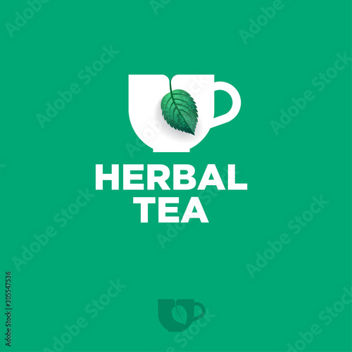 Herbal Tea logo. Cup with green leaf like label for tea bag. Premium product. Logo for cafe or tea shop.