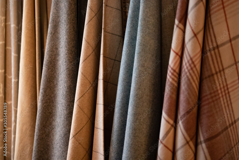 Obraz premium Tie-dyed fabrics from natural colors, hung on a clothesline arranged in rows. Wool