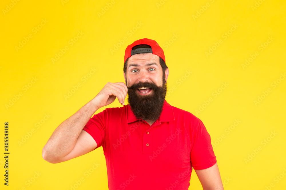 Best shampoo for your hair. bearded man red cap. male summer fashion. Barber salon and facial hair care. being trendy and brutal. Fashion portrait of man. smiling mature hipster yellow background